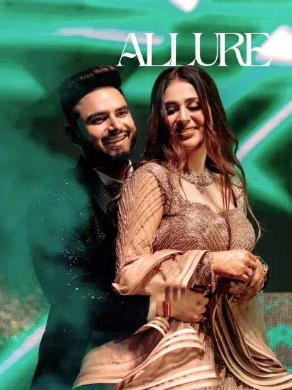 A joyful, candid shot of Akhilesh and Nisha dancing, with the groom's expression full of happiness. The title 'Allure' perfectly describes the couple's charm.