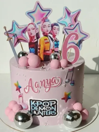 A K-Pop themed cake for a 6th birthday. This homemade eggless chocolate strawberry cake is decorated with disco balls and stars, perfect for a little superstar.