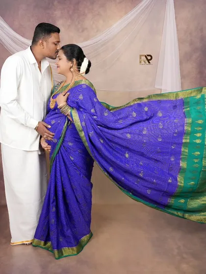 We honor tradition by creating elegant maternity portraits that reflect your cultural roots. This image, featuring a beautiful flowing saree and traditional styling, captures the grace and timeless beauty of Indian motherhood.