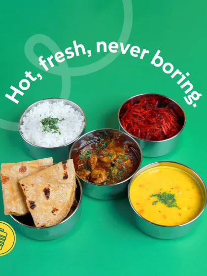 Hot, fresh, and never boring. Our daily veg tiffin with a delicious shrimp curry, dal, rice, salad, and rotis is designed to make you look forward to lunch. Wait, shrimp again? My apologies, let's just say it's a tasty curry!