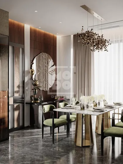 This view shows the dining area with its beautiful marble-topped table and a unique mirror that adds an artistic touch. The design is both luxurious and welcoming.