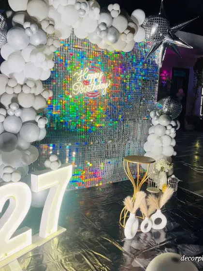 The way the light hits the sequin wall and balloon arch is just magical. This setup was designed to be the ultimate photo booth and centerpiece for the entire birthday celebration.