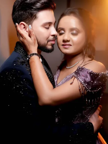 An intimate and romantic close-up of a couple at their engagement, with soft, warm lighting.