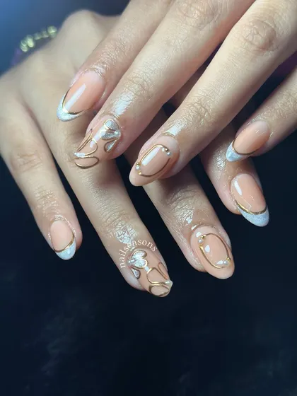 The pearl accents add a touch of elegance to this abstract gold and nude design.
