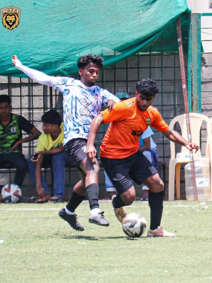 A physical duel for the ball. Our players never back down from a challenge on the pitch.
