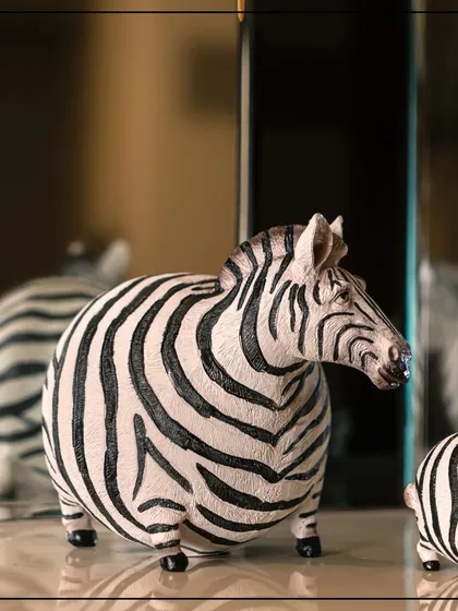 To show the bold side of my craft, I created The Wild Noir Collection. This striking zebra figurine embodies a fierce beauty and modern luxury, designed for those who wish to make a powerful and elegant statement in their home decor.