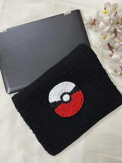 A top-down view of the custom crochet laptop sleeve, perfect for any Pokémon trainer. All my sleeves are made to order to fit your device perfectly.