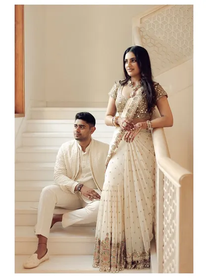 A beautiful portrait taken just after their engagement ceremony. The couple sits together, relaxed and happy, in the comfort of their own home, showing that stunning portraits can be made anywhere.