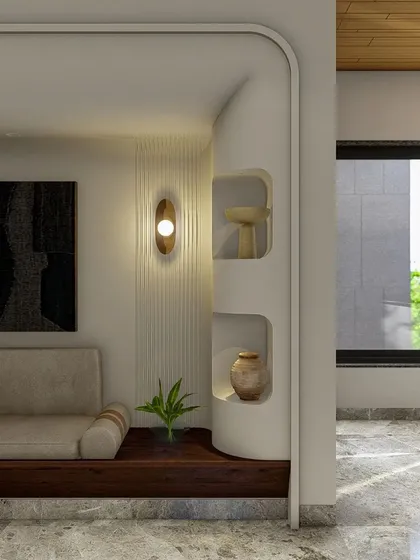 A cozy reading nook is carved out on the upper floor, featuring a built-in seat, curved walls with display niches, and a warm wooden ceiling, creating an intimate space overlooking the main living area.