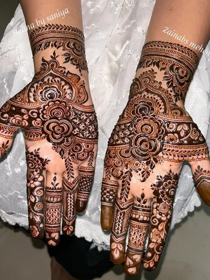 Another stunning Eid design, with a focus on bold floral work on the palms.