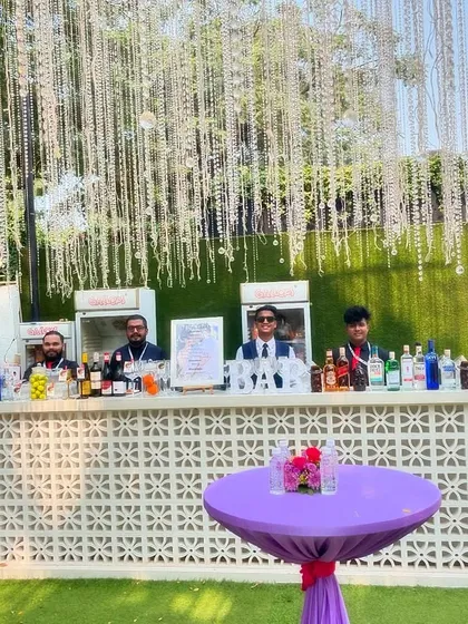 The team behind the bar, ready for a busy and fun-filled wedding event. We ensure we are well-staffed to keep the drinks flowing smoothly.