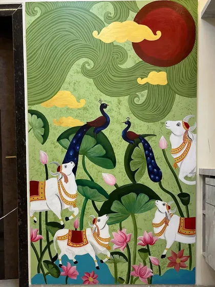 This is a complete view of a Pichwai-style mural I created for a client's home. This traditional Indian art form is filled with devotion, featuring decorated cows, peacocks, and lotus flowers. It brings a unique and spiritual warmth to any space.