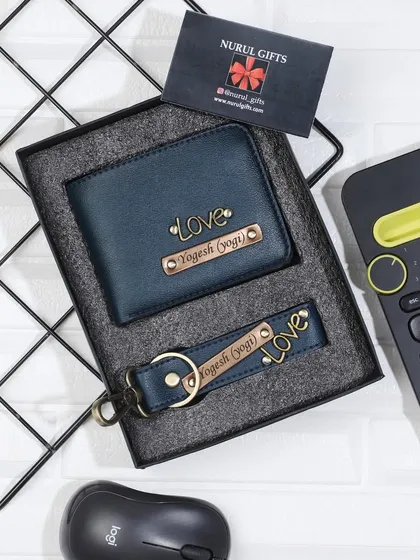 A personalized wallet and keychain set in a deep teal color, both customized with 'Love' charms and names.