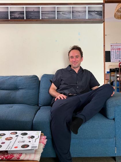 Our first artist-in-residence, Felix Baßler, relaxing in the studio. We partner with programs like the bangaloREsidency to host international artists and support their creative explorations.