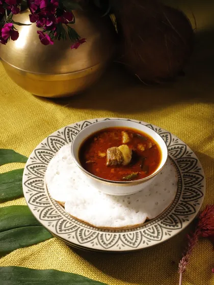 Soft, fluffy Appam, the perfect companion for a rich Mutton Curry. This is a staple of the Syrian Christian Easter breakfast, a hearty and flavourful start to the day's celebrations.