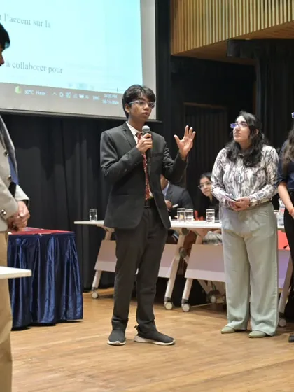A student delegate presenting their arguments during the MUN in French. The event challenges students to use their language skills in a formal, diplomatic context.