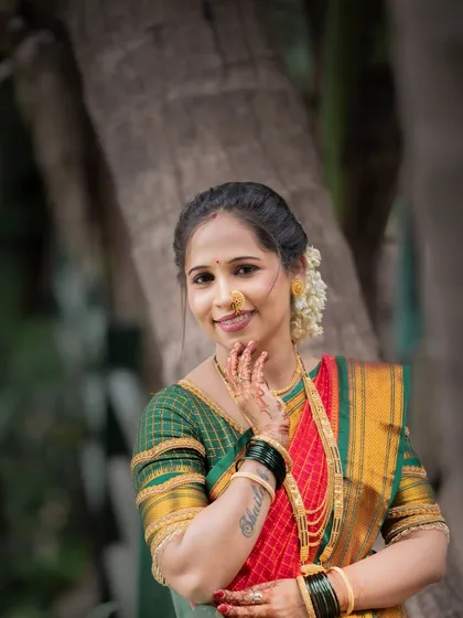 A bright and cheerful portrait of a woman celebrating Vat Purnima. Her smile and traditional attire radiate happiness and cultural pride.
