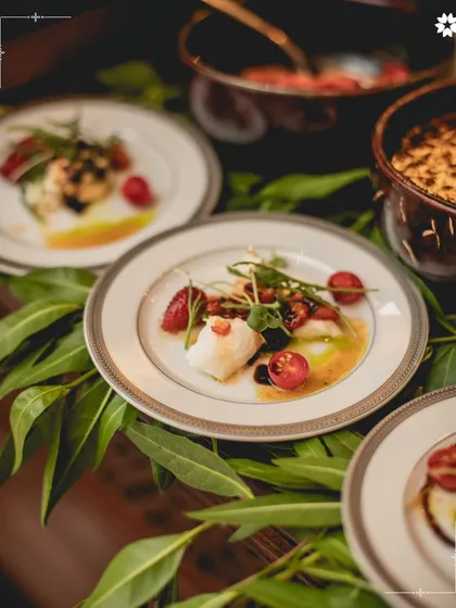 A plate of Burrata di Puglia, where creamy cheese meets the subtle sweetness of chilli jam and fresh basil pesto. This dish represents our philosophy: honouring classic ingredients with a contemporary, artful touch for a refined culinary experience.