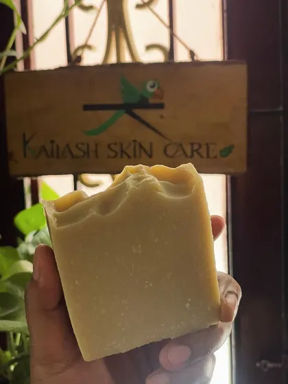 Here is a freshly cut bar of my Multanimitti Avocado Butter soap, held up against my brand sign. This soap is suitable for all skin types and is great for achieving bright, acne-free skin.