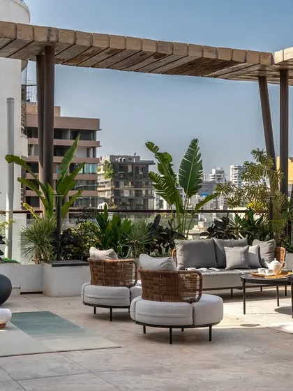 In a city like Mumbai, a spacious terrace is the ultimate luxury. We designed this 1,000 sq.ft. outdoor oasis as a true extension of the home. It’s a versatile space for morning yoga, quiet reflection, or hosting parties under the stars, surrounded by lush greenery.