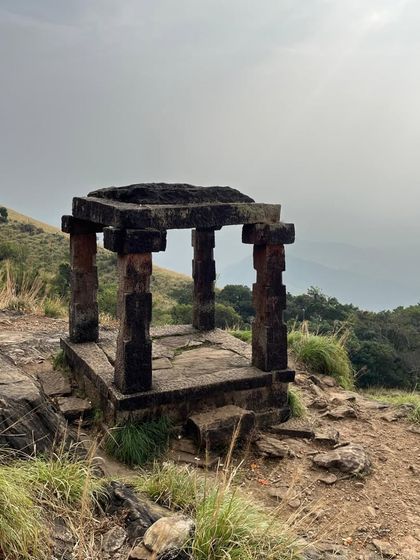 The iconic stone Mantapa stands alone against the sky, a silent witness to countless trekkers who have passed this way.