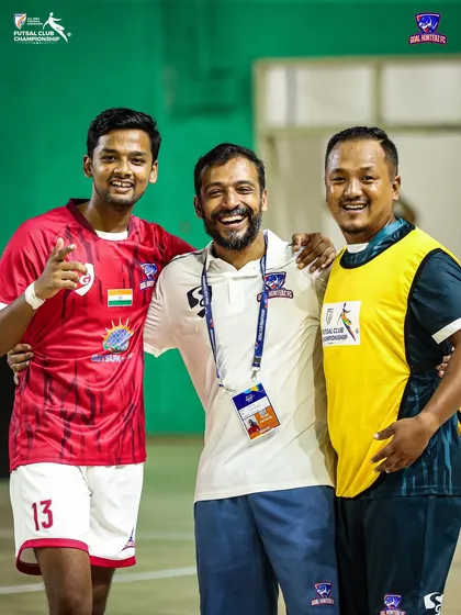 Smiles all around. Our players and coaches sharing a happy moment after the win.