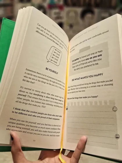An inside look at 'Manifest for Kids!', which includes journaling prompts and activities to encourage self-reflection and happiness.