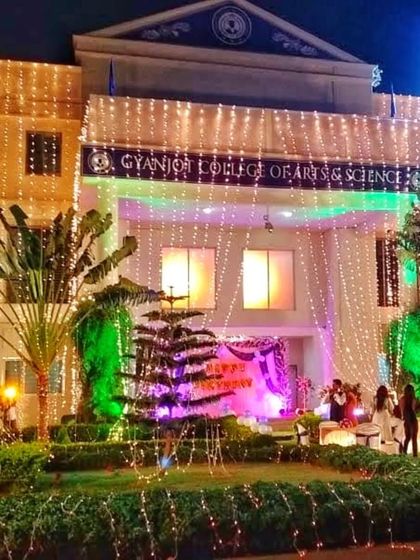 My lighting services extend to building exteriors. Here, I've decorated a college building with strings of fairy lights for an annual function, transforming the facade and creating a festive look for the event.