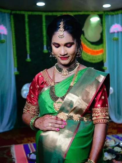 A special look for a special day. For Sonu's seemantha, we went with a traditional look featuring a bold red lip and glowing skin to celebrate this beautiful moment.