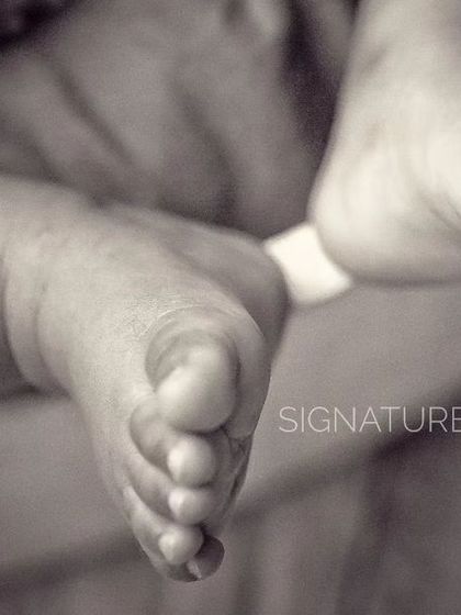 Ten tiny toes. This black and white close-up focuses on the perfection of a newborn's feet, a detail that changes all too quickly.