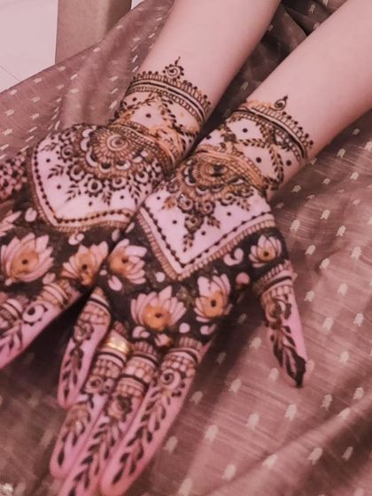 A beautiful design with a lotus pond theme. The dark-filled background makes the lotus flowers on the palm pop.