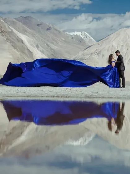 This is what pre-wedding dreams are made of. My royal blue infinity trail gown creates a stunning contrast against the serene mountain landscape, perfect for a truly epic destination photoshoot.