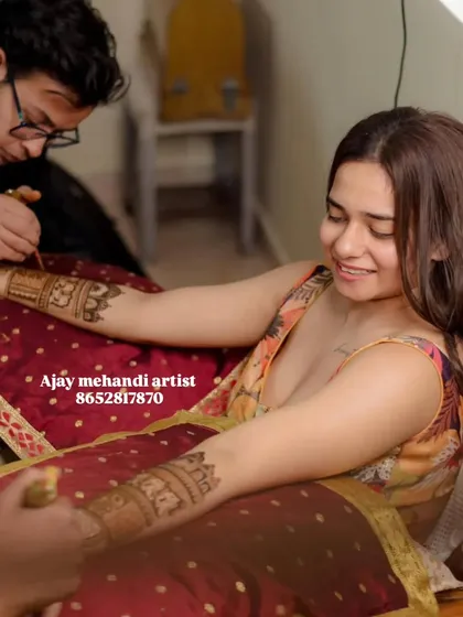 A behind-the-scenes look as I apply mehndi for a smiling client. I make sure you are comfortable throughout the process.