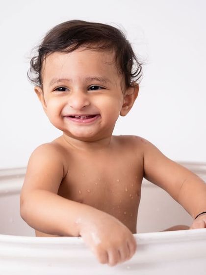 The biggest, happiest smile from the tub. The splash part of the session often results in the most joyful and relaxed photos of the day.
