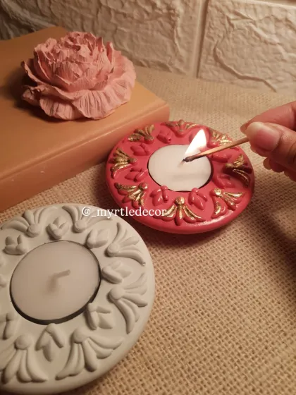 The simple act of lighting a diya can bring so much warmth. Here is one of our ornate Jesmonite T-light holders, hand-painted with gold accents to catch the light beautifully. It’s a small piece designed to make a big impact during the festive season.