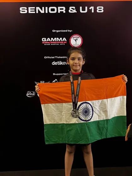 Mishty proudly holding the Indian flag with her silver medal. This is just the beginning of her journey to the top.