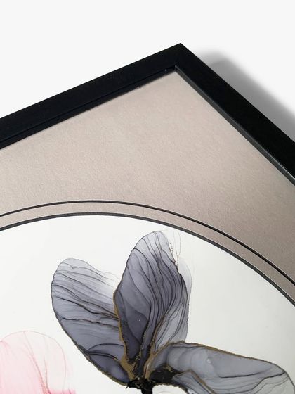 Another close-up of the floral artwork, showing the delicate lines of the painting and the clean edge of the circular mat opening.