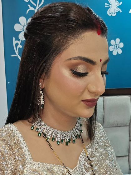 A close-up of the soft brown and gold eye makeup. It's a classic combination that never goes out of style.