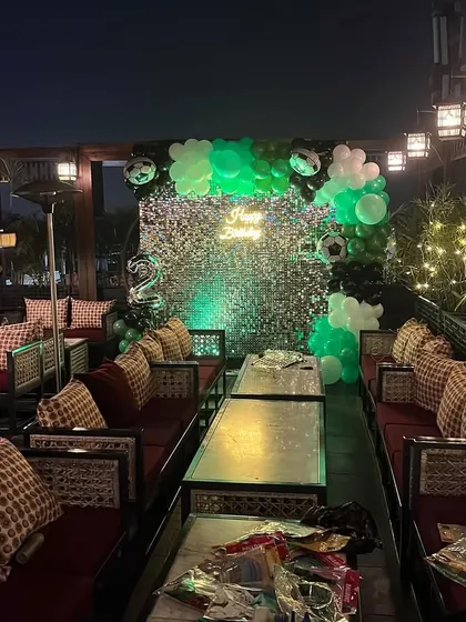 Another angle of the football-themed party, with the shimmer wall catching the light.