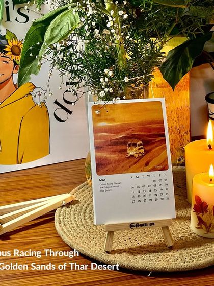 The May page, 'Catbus Racing Through the Golden Sands of Thar Desert', on display. The warm, orange tones of this piece are so vibrant.