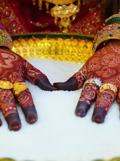 The beautiful engagement mehndi for Fazila, with her and her partner's initials 'AF' and 'FA' on her palms.