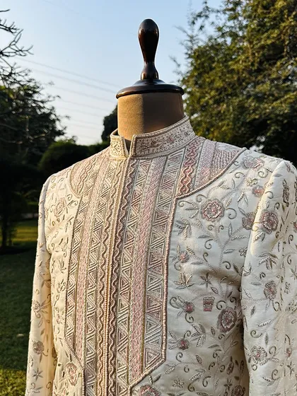 This is our Koyaliya Sherwani, a masterpiece crafted from luxurious, cruelty-free Ahimsa silk. Over 120 hours of intricate hand embroidery go into each piece, telling a story of artistry and timeless elegance.