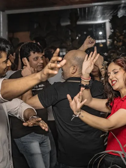 The joy of dancing with friends, completely lost in the music.