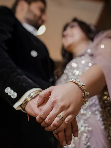 The promise in your hands. We believe the small details tell a big story. This close-up from an engagement shoot focuses on the connection and the commitment, a simple yet profound image.