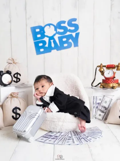 Here's my take on the popular 'Boss Baby' theme. This little one is styled in a mini suit, looking cool and in charge, surrounded by fun props like a vintage phone and money bags.