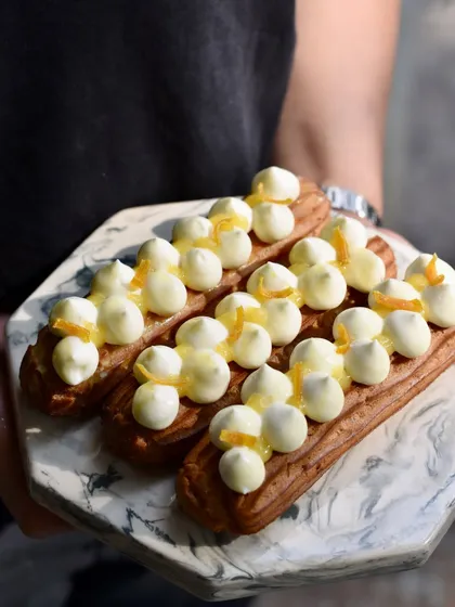 Our Orange & Vanilla Eclairs are like a little bite of sunshine to start the new year. They are filled with vanilla diplomat cream and our house-made orange marmalade.