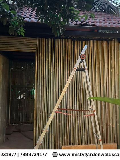 An exclusive bamboo house setup with a classic Mangalore tile roof. This eco-friendly structure provides a rustic and charming retreat, perfect for a farmhouse setting.