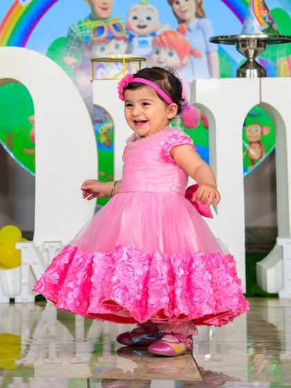 A magical 'Under the Sea' themed birthday party, with shimmering blue and green decor, seashell props, and mermaid cutouts, creating an enchanting underwater world.