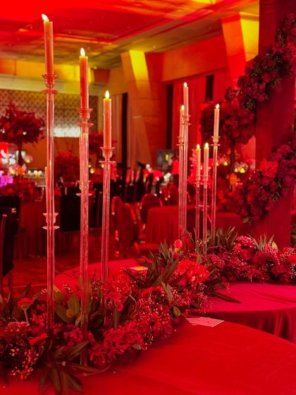 The long tables were lined with sleek, modern candelabras, creating a beautiful rhythm down the length of the room. The contrast between the modern stands and the lush, romantic florals is a signature part of our style.