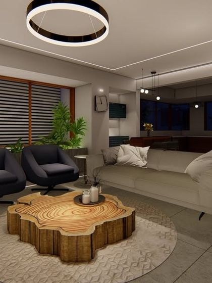 This cozy living room nook is designed for relaxation and quiet moments. It features a live-edge wood coffee table, comfortable armchairs, and soft, indirect lighting to create a warm and inviting atmosphere.